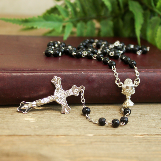   Black Wood 5mm Bead Rosary with Eucharist Center - 17"    (Minimum quantity purchase is 1)